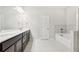 Double vanity bathroom with soaking tub and separate shower at 6233 Thorncrest Dr, Tucker, GA 30084