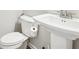 Clean bathroom with pedestal sink, toilet and shower at 6233 Thorncrest Dr, Tucker, GA 30084