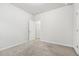 Bright bedroom featuring neutral walls and carpeted floors at 6233 Thorncrest Dr, Tucker, GA 30084
