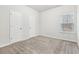 Spacious bedroom with neutral carpeting and ample closet space at 6233 Thorncrest Dr, Tucker, GA 30084