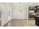 Empty dining room with hardwood floors and a view of the kitchen at 6233 Thorncrest Dr, Tucker, GA 30084