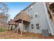 Townhome showcasing private deck and wooded views at 6233 Thorncrest Dr, Tucker, GA 30084