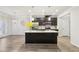 Modern kitchen with island, stainless steel appliances, and hardwood floors at 6233 Thorncrest Dr, Tucker, GA 30084