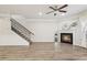 Bright living room with hardwood floors, fireplace and staircase at 6233 Thorncrest Dr, Tucker, GA 30084