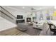 Spacious living room with fireplace, hardwood floors, and large windows at 6233 Thorncrest Dr, Tucker, GA 30084