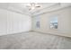 Large main bedroom with plush carpet and ceiling fan at 6233 Thorncrest Dr, Tucker, GA 30084