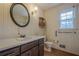 Bathroom with vintage vanity, toilet and window at 118 Knotts Landing Dr, Woodstock, GA 30188