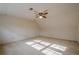 Spacious bedroom with ceiling fan and carpet at 118 Knotts Landing Dr, Woodstock, GA 30188