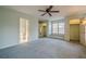 Main bedroom with window seat, ceiling fan and carpet at 118 Knotts Landing Dr, Woodstock, GA 30188