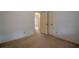 Bright bedroom with access to another room and neutral colored carpet at 118 Knotts Landing Dr, Woodstock, GA 30188