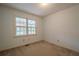 Spacious bedroom with ample natural light and wall-to-wall carpet at 118 Knotts Landing Dr, Woodstock, GA 30188