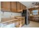 Kitchen with wood cabinets and built in desk at 118 Knotts Landing Dr, Woodstock, GA 30188
