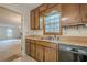 Kitchen features wood cabinets and a double sink at 118 Knotts Landing Dr, Woodstock, GA 30188