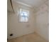 Laundry room with shelving and window at 118 Knotts Landing Dr, Woodstock, GA 30188
