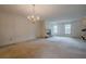 Bright living room with fireplace and carpeting at 118 Knotts Landing Dr, Woodstock, GA 30188