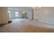 Open living room showcasing staircase and fireplace at 118 Knotts Landing Dr, Woodstock, GA 30188