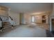 Living room with fireplace, staircase, and view into dining area and kitchen at 118 Knotts Landing Dr, Woodstock, GA 30188