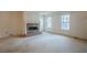Living room with brick fireplace and carpeted floors at 118 Knotts Landing Dr, Woodstock, GA 30188