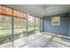 Screened porch with wood flooring and leafy views at 118 Knotts Landing Dr, Woodstock, GA 30188