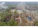 Aerial view of house and surrounding wooded area at 130 Wesleyan Way, Oxford, GA 30054
