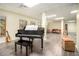 Finished basement with grand piano and seating area at 130 Wesleyan Way, Oxford, GA 30054