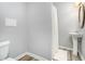 Basement bathroom with pedestal sink and shower at 130 Wesleyan Way, Oxford, GA 30054