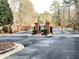 Gated entrance to a community with brick columns and black iron fencing at 130 Wesleyan Way, Oxford, GA 30054