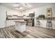 Basement kitchen with island and stainless steel appliances at 130 Wesleyan Way, Oxford, GA 30054
