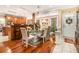 Kitchen with an island, breakfast nook, and hardwood floors at 130 Wesleyan Way, Oxford, GA 30054