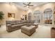 Spacious living room with a large sectional sofa and access to a deck at 130 Wesleyan Way, Oxford, GA 30054