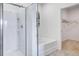 Bathroom featuring a glass-door shower and tub, with a view into the walk-in closet at 8587 Seabiscuit Rd, Lithonia, GA 30058
