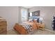 Comfortable bedroom with a window, dresser and sports-themed decorations at 8587 Seabiscuit Rd, Lithonia, GA 30058