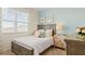 Charming bedroom featuring soft colors, detailed dressers and plenty of natural light at 8587 Seabiscuit Rd, Lithonia, GA 30058