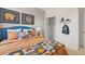 Cozy bedroom with baseball-themed decor, upholstered headboard and walk-in closet at 8587 Seabiscuit Rd, Lithonia, GA 30058