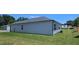 Home exterior showing siding and green lawn at 8587 Seabiscuit Rd, Lithonia, GA 30058