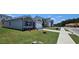 Street view of home showing garage and lawn at 8587 Seabiscuit Rd, Lithonia, GA 30058