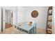 Home office with desk, built-in shelving and neutral carpet at 8587 Seabiscuit Rd, Lithonia, GA 30058