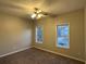 Bedroom with carpet, ceiling fan and view of the street at 1537 Cedar Bluff Trl, Marietta, GA 30062