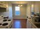 Efficient kitchen with white appliances and wood-look floors at 1537 Cedar Bluff Trl, Marietta, GA 30062