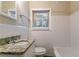 Clean bathroom, granite countertop, and white tile at 2906 Monterey Dr, Decatur, GA 30032