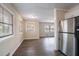 Dining area with dark gray vinyl flooring and access to the kitchen at 2906 Monterey Dr, Decatur, GA 30032