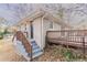 Brick ranch home with wooden deck and steps leading to the front entrance at 2906 Monterey Dr, Decatur, GA 30032