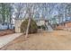 Ranch home with steps leading to the front entrance and a spacious yard at 2906 Monterey Dr, Decatur, GA 30032