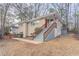 Brick Ranch home with a red front door and wooden stairs at 2906 Monterey Dr, Decatur, GA 30032