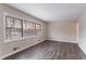 Bright living room with large windows and dark gray vinyl flooring at 2906 Monterey Dr, Decatur, GA 30032