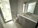 Modern bathroom with marble vanity, shower, and updated fixtures at 2148 Lilac Ln, Decatur, GA 30032