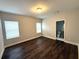Spacious bedroom with dark hardwood floors and neutral walls at 2148 Lilac Ln, Decatur, GA 30032