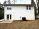 Rear view of a two-story white house with french doors at 2148 Lilac Ln, Decatur, GA 30032