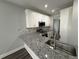 Modern kitchen with white cabinets, granite countertops, and stainless steel appliances at 2148 Lilac Ln, Decatur, GA 30032