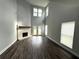High ceiling living room with hardwood floors, fireplace and French doors leading to backyard at 2148 Lilac Ln, Decatur, GA 30032